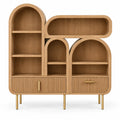 Bibliothèque beige asymétrique à niches arrondies et tiroirs striés